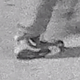 A grainy image of the shoes worn by the suspect sought in connection with the pipe bombs found at the Republican and Democratic national committees